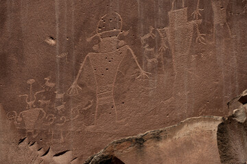 Humanoid Petroglph Surrounded By Small Goat Figures