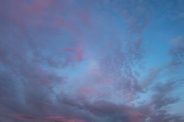Obraz na płótnie Canvas abstract background of dramatic cloudy sunset sky blue hour