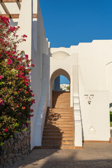 Detail of stairs and white wall of a house on the street of Egypt in Sharm El Sheikh