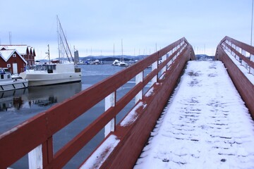 snow-covered wooden bridge in the port - Holmestrand
