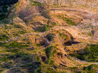 Drop down view of trail following volcanic mountain ridge.