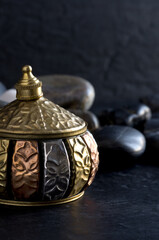 Ancient Incense Container with Rocks on Dark Background