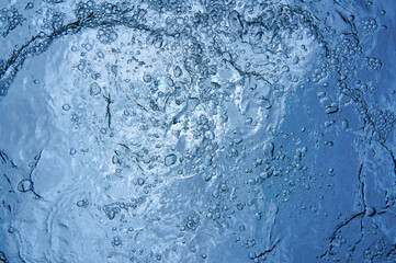 Air bubbles underwater below water surface, natural scene, Caribbean sea