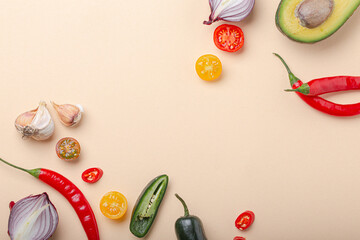 Creative cooking healthy organic food concept background made of colourful fruit and vegetables on beige background flat lay: tomatoes, broccoli, avocado, onion, garlic top view with space for text
