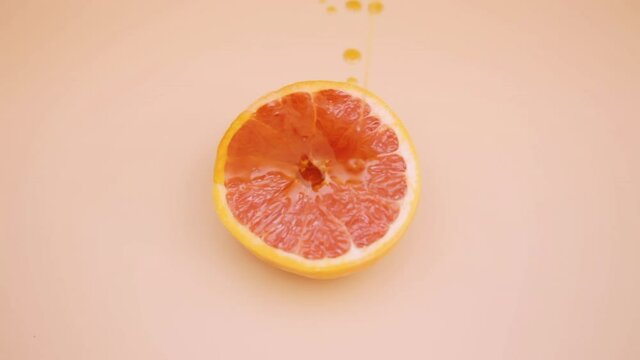 Hot fruit sex: a ripe grapegruit, getting covered with juicy sticky syrup. For when you can't show the real thing (vagina excitation, petting, intercourse).

