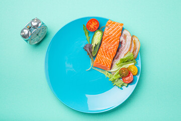 Intermittent fasting low carb hight fats diet concept flat lay, healthy food salmon fish, bacon...