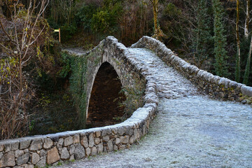 Puente de la Margineda (Pont de la Margineda), a medieval stone bridge in Andorra, in winter, with some snow