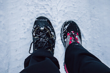 Closeup of hiking boots in the snow