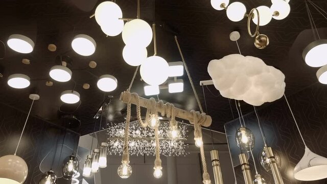 Excellent, luxury, beautiful, modern, creative, bright chandeliers with sparkling elements. Shot in motion