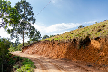 Winding dirt road with ravine and trees on the sides, Tres Picos State Park, Teresopolis, Rio de Janeiro, Brazil © Raphael