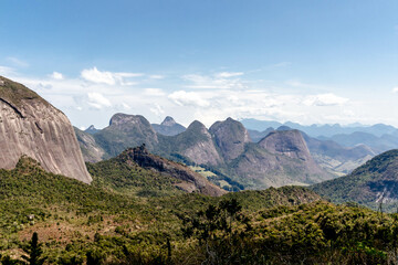 Fototapeta na wymiar Panorama of Vale dos Frades with the match box peak and several other points for climbing and trekking and Serra dos Orgãos in the background, PNSO, Teresopolis, Rio de Janeiro, Brazil