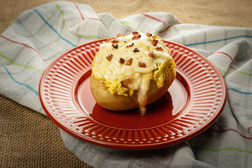 Baked potato with bacon and cheese, shredded chicken stuffing
