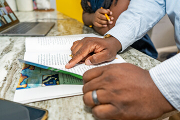 Father helping daughter do homework