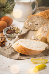 Ingredients for preparing spanish torrijas, french toasts  or traditional Portuguese rabanadas. Typical christmas food made with bread, eggs, cinnamon, cardamom, anise star, milk and lemon peel