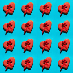From someone with love on Saint Valentine's Day concept. Gift cookies made in form of heart and button at the same time on pink background. Flat layout. Close up. Pop-art style. Studio shot
