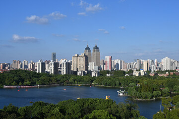 Fototapeta na wymiar Lake view of city Park in downtown Shanghai, China