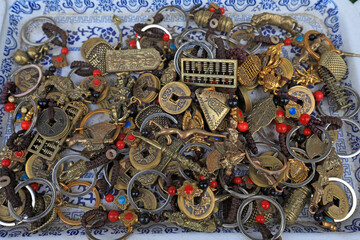 Copper handicrafts are stacked together in a shop in North China