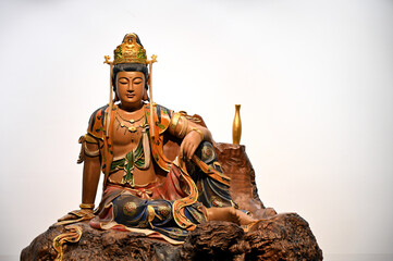 Wood carving of guanyin Bodhisattva Buddha at a Chinese temple