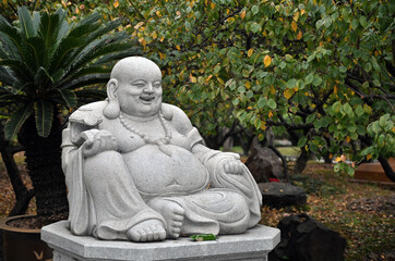 Fototapeta na wymiar The Statue of Maitreya bodhisattva in China's City Park