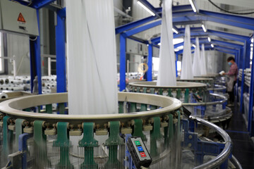 Workers work hard in the plastic weaving workshop, North China
