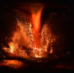 Dirty door of an fireplace with burning fire and flames