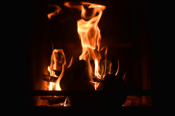 Flames in a fireplace with wood and coal burning
