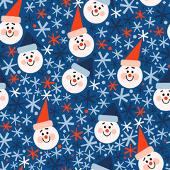 Seamless vector pattern with cute colorful snowmen in red and blue hats and colorful snowflakes. Bright red, white, blue winter pattern. Winter festive background for print, wrapping paper, textile.