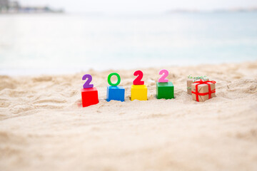 several multi-colored cubes with the numbers of the year 2022