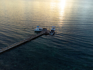Fototapeta na wymiar Aerial photo of a boat on the beach of Cozumel in Mexico