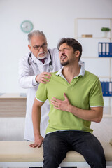 Young male patient visiting old male doctor