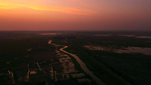 Paddy Fields And Creek During Sunset In Vasai, Maharashtra, India. - aerial