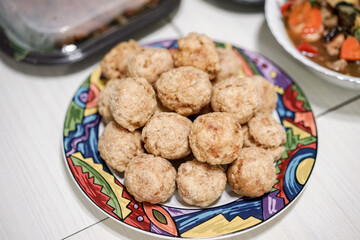Fried greek meatballs with pita bread and dill on a plate