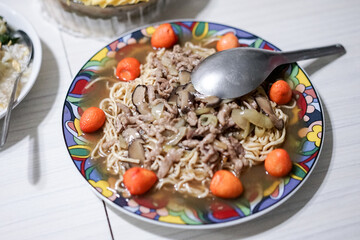 Noodle with mushroom and quail eggs for birthday on a plate