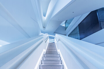 Fototapeta premium Interior view of empty futuristic stairway. Modern building abstract background