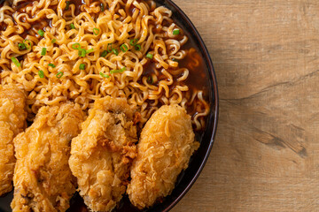 Korean instant noodles with fried chicken or Fried chicken ramyeon