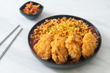 Korean instant noodles with fried chicken or Fried chicken ramyeon