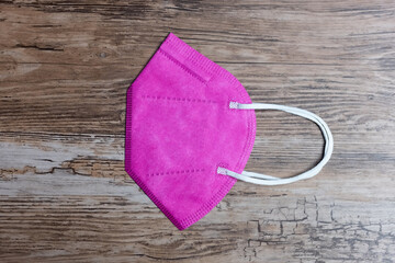 close up to face masks on bright desk. Protection against coronavirus, flu and other airborne...