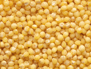 Close-up of millet groats as background.