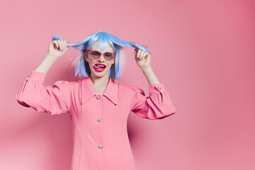 woman in blue wig pink dress red lips isolated background
