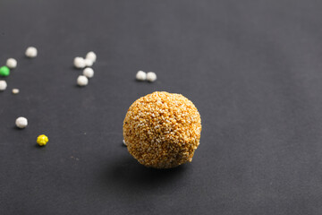 Indian sweet for traditional festival makar sankranti :Rajgira laddu made from Amaranth seed in Bowl on white background.