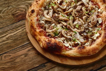 Delicious homemade pizza with mozzarella, mushrooms, beef and chicken. Wooden background, selective focus.