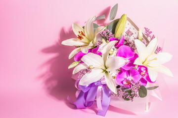 A beautiful bouquet of fresh flowers on a pink background