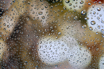 water drop, rain drop on glass with a beautiful background