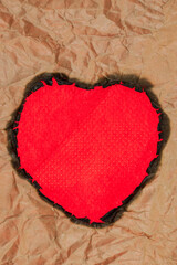 Brown paper burning heart shaped.