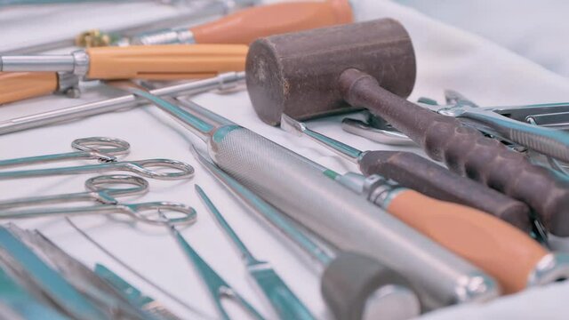 Steel sterile surgical tools lying on table during operation
