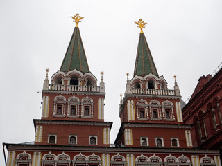 Fototapeta na wymiar Red Square. Observation towers of the main entrance against a cloudy sky. Moscow, Russia. Close-up.