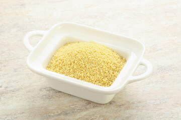 Raw couscous in the bowl
