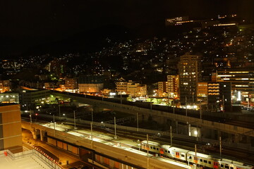 Fototapeta na wymiar Nagasaki Station and Cityscape of Nagasaki at Night in Nagasaki, Japan - 日本 長崎県 長崎駅 駅前 街並みの夜景 