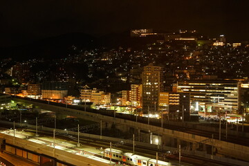 Fototapeta na wymiar Nagasaki Station and Cityscape of Nagasaki at Night in Nagasaki, Japan - 日本 長崎県 長崎駅 駅前 街並みの夜景 