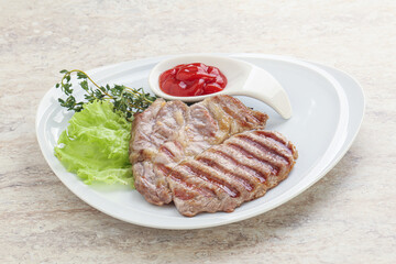 Grilled pork neck steak with ketchup
